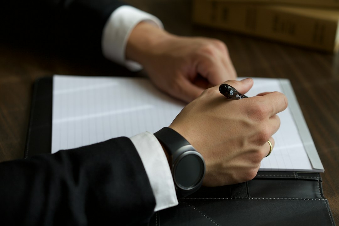 Home a-person-in-a-suit-writing-on-a-document-bofrosjzrns