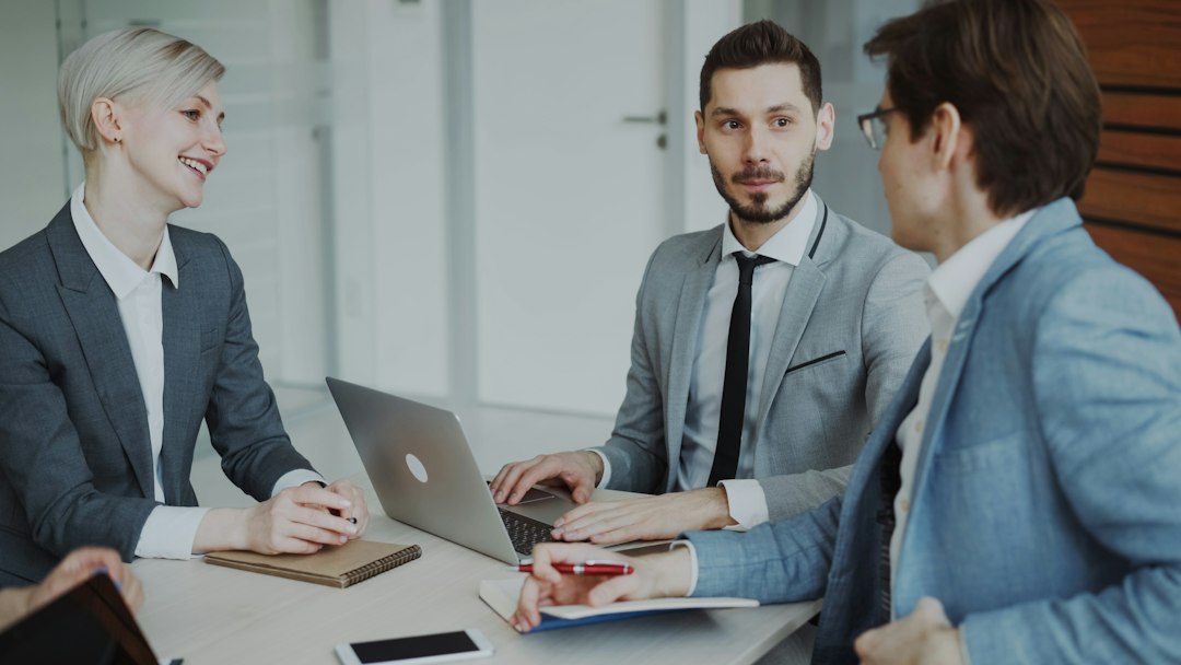 Menu 🎬 FULL 4K VIDEO for this still is in my bio link! ⬇️ Businessman discussing future business project with male and female colleagues sitting at the table in modern office indoors